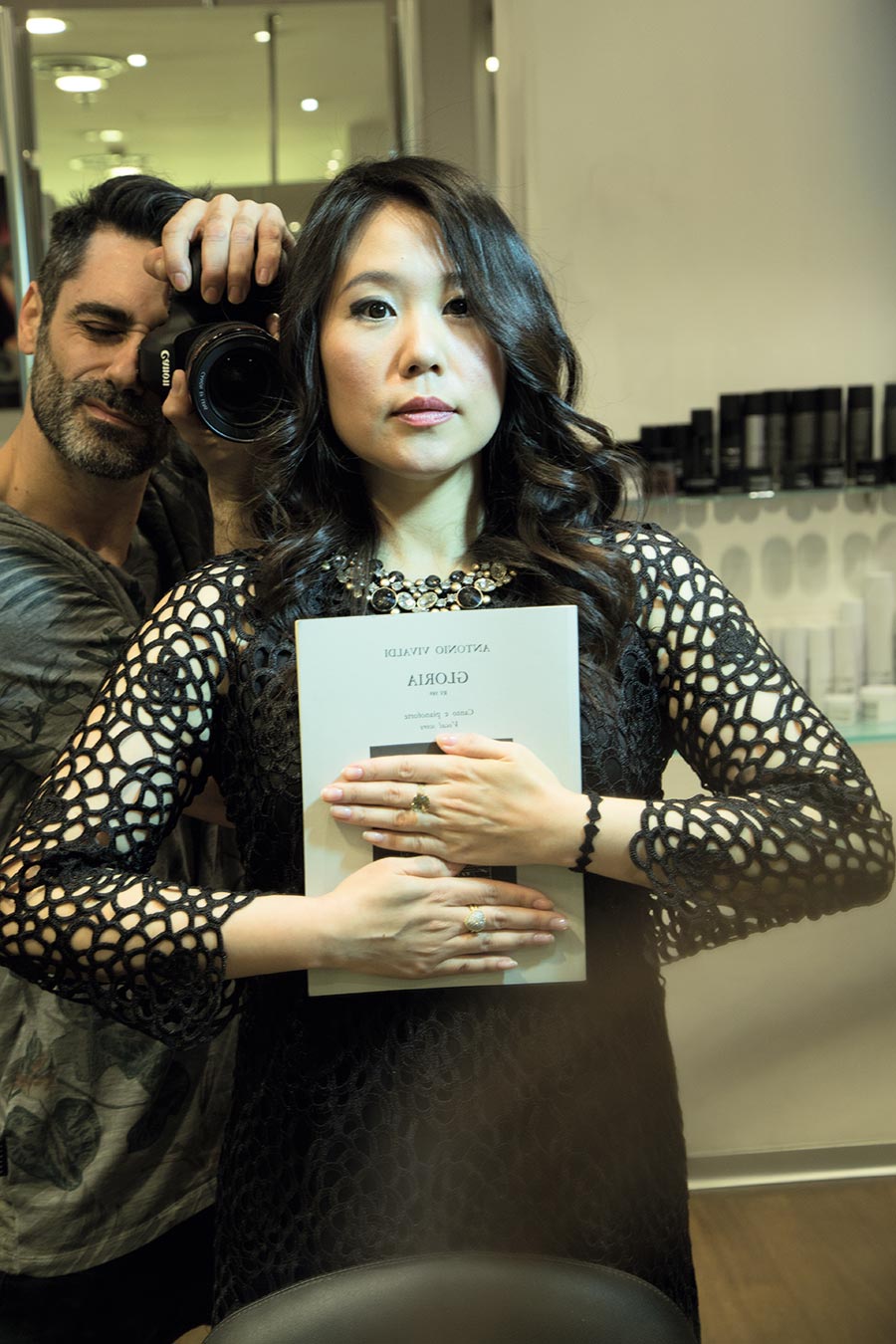 The opera singer Moon Jin Kim holds one of her scores while posing for the photographer Max Di Vincenzo. Photos by Max Di Vincenzo, Milan, Italy